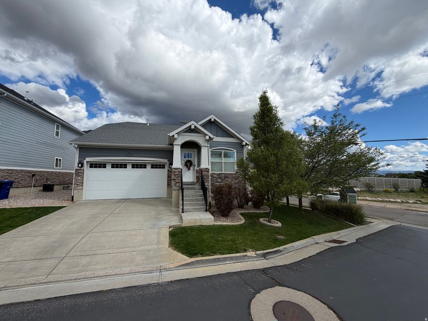 This immaculate rambler in Fruit Heights is nestled in one of Northern Utah's most desirable locations. The interior features an open great room and kitchen, granite countertops, upgraded appliances, custom lighting, vaulted ceilings, and a spacious primary suite complete with a walk-in closet and a luxurious bath with a separate garden tub and shower.  Designed for both comfort and efficiency, the home includes a Nest thermostat, gas fireplace, quick-recovery 50-gallon water heater, and blown-in insulation for lower utility costs and affordable living. The basement offers a finished bedroom in a convenient location along with 9-foot ceilings that create an open, spacious feel.  Outside, the backyard is fully fenced and showcases breathtaking mountain views