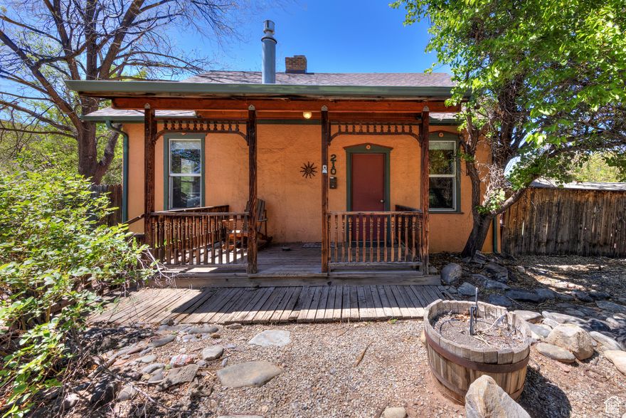 Endless possibilities in a downtown location!  Make this home your own or a fabulous place for your business.  Built in 1924, this property has character that can't be bought...hardwood floors, exposed brick...come inside and see for yourself. Large corner lot with plenty of outdoor space and room for parking.  New roof in 03/2025. C5 zoning offers many opportunities including professional offices, day care, restaurants, multi unit dwellings and much more.  Information should be verified with the City of Moab.