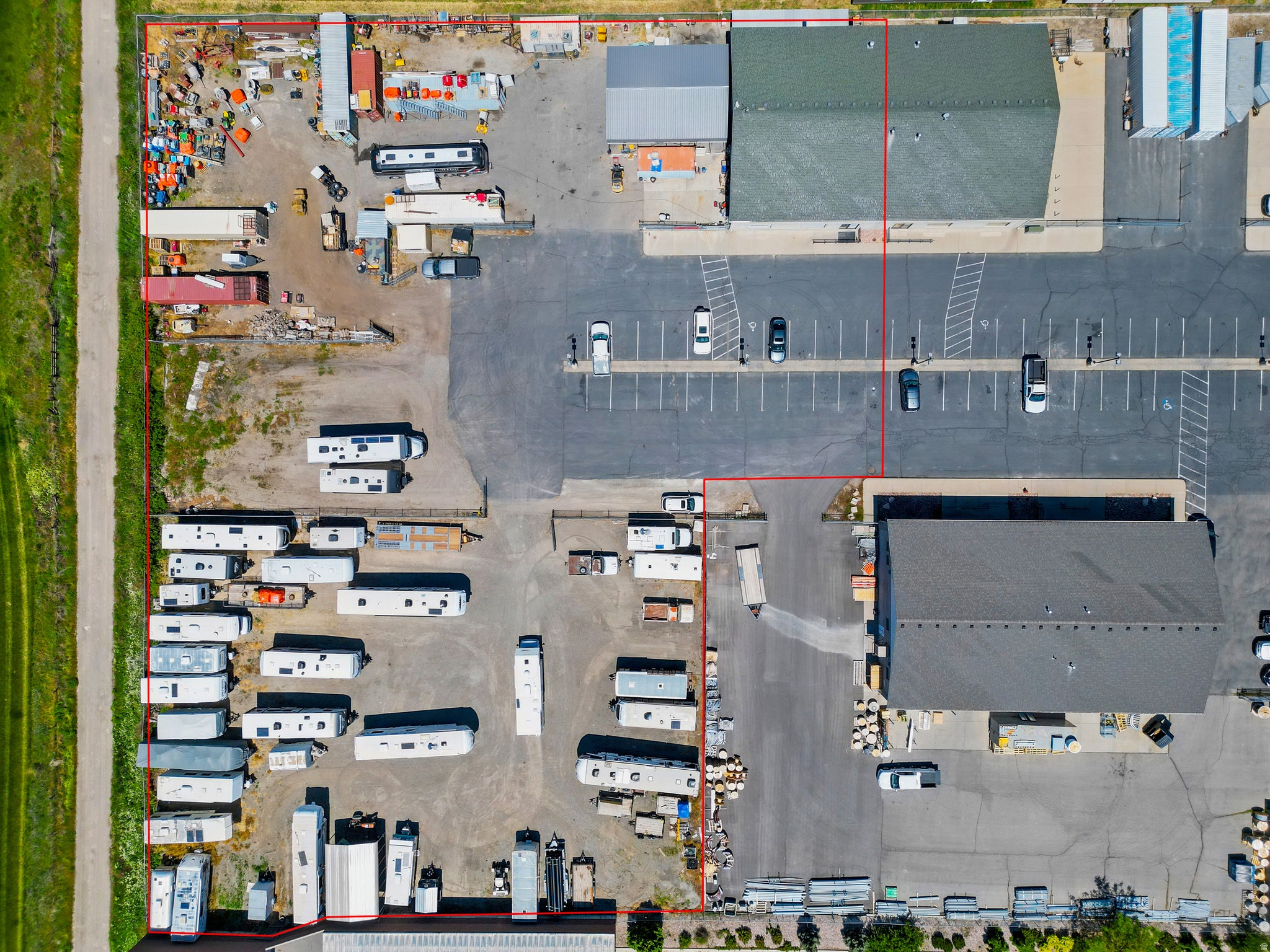 Expansive commercial property, extensive paved parking areas, and substantial open land