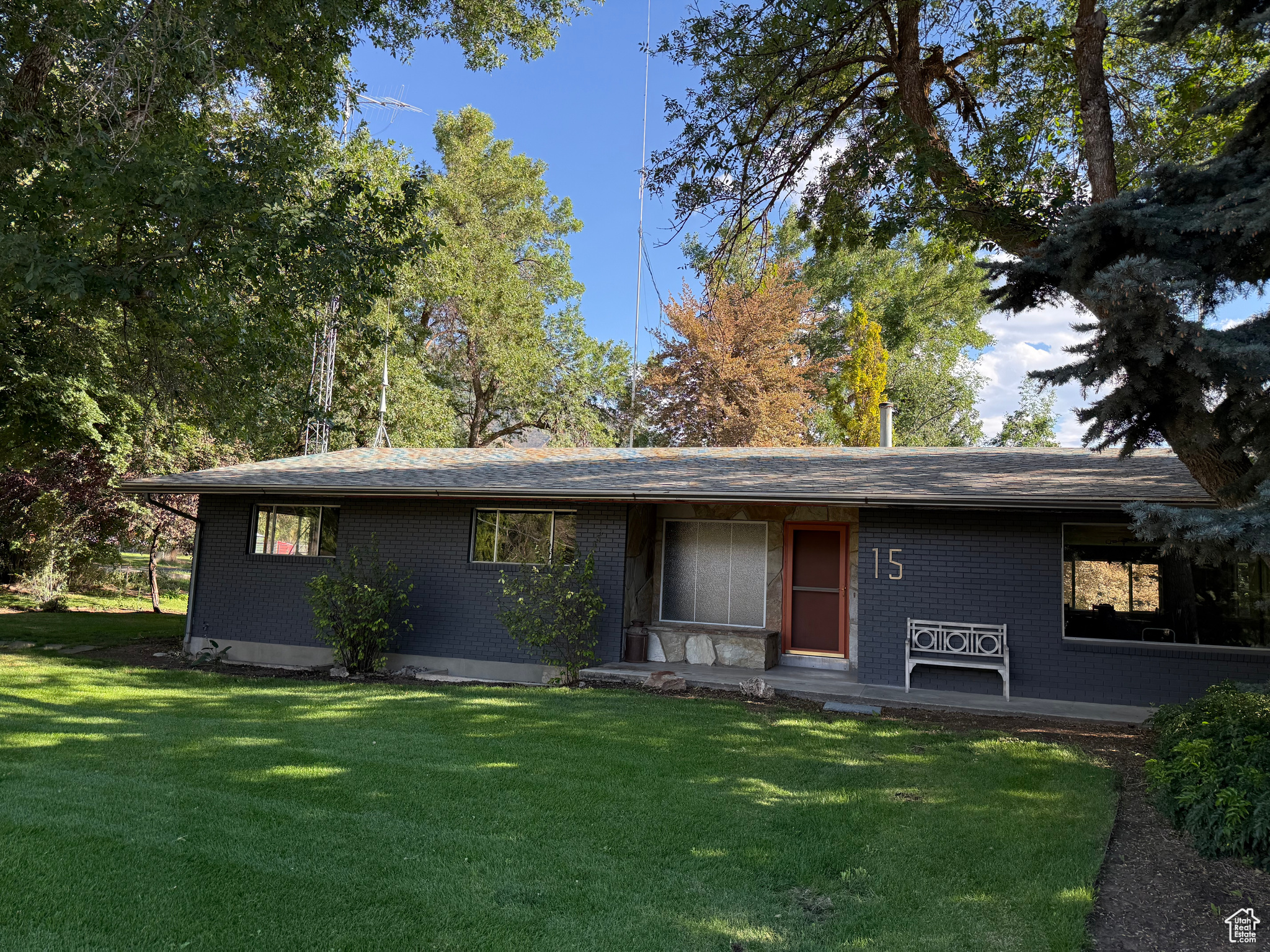 Welcome to this beautifully maintained, 1971 classic in the heart of Mapleton. Complete with a spacious .87 acre lot, a gorgeous yard, and a great layout you won't be disappointed. Step inside to a flowing open floor plan and into a lovely kitchen designed for style and convenience, featuring a gas cooktop, wall oven, quartz countertops, custom cabinetry, and a fresh tile backsplash-perfect for hosting and everyday living. With 3 spacious bedrooms 2 great bathrooms, laundry/mudroom and kitchen on the main, you may never need the fully finished basement. The basement is complete with 3 more bedrooms, a large walk-in closet complete with a washer and dryer and large entertaining and storage space for whatever you choose. The basement also boasts a unique in-home greenhouse space to prep your garden for spring or grow something you've always dreamed! There's even a walk-out basement patio and a workshop for more hobby or storage space. The yard is perfect for entertaining or just enjoying yourself, with hundreds of bulb flowers that pop up every spring, and beautiful mature trees and plants throughout providing shade and beauty all around. This home was built solid with 4000+ sq ft, and now has been updated with new carpet, countertops, paint, and LVP flooring to bring this well-built classic into this century. You don't want to miss out on this one so hurry and make your appointment today!
