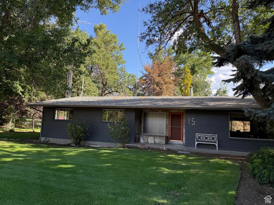 Welcome to this beautifully maintained, 1971 classic in the heart of Mapleton. Complete with a spacious .87 acre lot, a gorgeous yard, and a great layout you won't be disappointed. Step inside to a flowing open floor plan  and into a lovely kitchen designed for style and convenience, featuring a gas cooktop, wall oven, quartz countertops, custom cabinetry, and a fresh tile backsplash-perfect for hosting and everyday living. With 3 spacious bedrooms 2 great bathrooms, laundry/mudroom and kitchen on the main, you may never need the fully finished basement. The basement is complete with 3 more bedrooms, a large walk-in closet complete with a washer and dryer and large entertaining and storage space for whatever you choose. The basement also boasts a unique in-home greenhouse space to prep your garden for spring or grow something you've always dreamed! There's even a walk-out basement patio and a workshop for more hobby or storage space. The yard is perfect for entertaining or just enjoying yourself, with hundreds of bulb flowers that pop up every spring, and beautiful mature trees and plants throughout providing shade and beauty all around. This home was built solid with 4000+ sq ft, and now has been updated with new carpet, countertops, paint, and LVP flooring to bring this well-built classic into this century. You don't want to miss out on this one so hurry and make your appointment today!