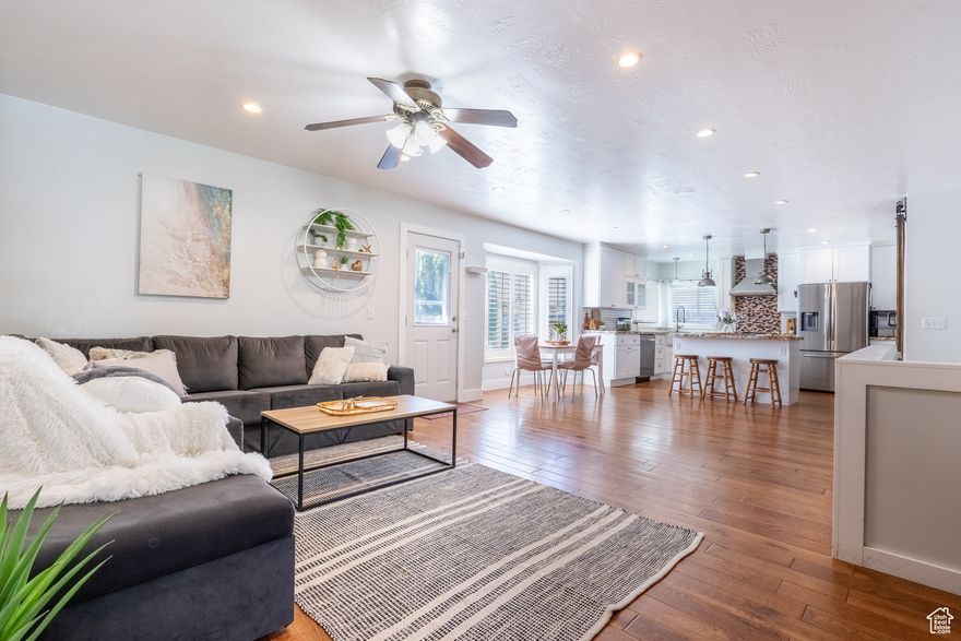 ***BLACK FRIDAY SPECIAL*** $25,000 price reduction** AND $10,000 towards *rate* buy* down* this weekend only*** Be in a new HOME FOR THE HOLIDAYS!!  This beautifully maintained brick rambler offers spacious single-level living in a quiet, established West Jordan community. The open floor plan features a bright and inviting layout, centered around a stylish, updated kitchen with hardwood floors that truly make it the heart of the home. The main  level boasts a large primary suite with a bay window, walk-in closet, relaxing soaker tub, and separate shower. Two additional bedrooms with oversized windows provide plenty of natural light. Downstairs, you'll find two more generously sized bedrooms, a full bathroom, and a fun-filled living area complete with a pool table, projector, and screen perfect movie nights. Step outside to enjoy the large covered patio, a charming playhouse, and a spacious shed for all your storage needs. HUGE driveway (30'x52') and convenient RV plug! Major updates include a brand-new furnace and water heater.  Square footage figures are provided as a courtesy estimate only and were obtained from county records.  Buyer is advised to obtain an independent measurement.