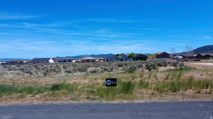 Come experience country living at its finest in Cottonwood Ranches--Enterprise's newest premier equestrian subdivision. Designed with horse lovers and those seeking space in mind, this community offers large lots ranging from 0.5 to 1.5 acres. Lot #16 features 1.01 acres of flat, usable land--perfect for building your dream home, barn, and corrals. Located within Enterprise city limits, utilities include water, power, fiber optics, and natural gas, with septic required for sewer. Up to 5 large animals are permitted. Enjoy the charm of Enterprise, a self-sufficient rural community offering grocery stores, restaurants, schools, medical services, and more--all while being just 40 minutes from St. George and Cedar City. Bring your own builder and create your ideal lifestyle. Impact fees are approximately $13,000.