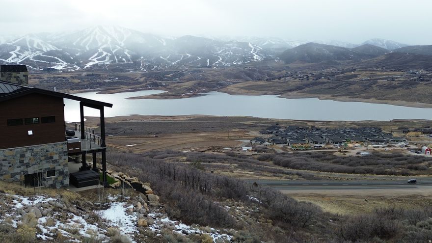 Build your mountain masterpiece on this prime 0.24-acre homesite in the prestigious Soaring Hawk community. Perfectly oriented for a downhill build, this lot offers the ideal topography for a stunning multi-level home with a walk-out lower level and "views from every pillow." Capture unobstructed, panoramic northwestern vistas of the sparkling Jordanelle Reservoir and the world-class ski runs of Deer Valley Resort. Enjoy a lifestyle defined by outdoor adventure with over 3 miles of community hiking and biking trails at your doorstep. Located just minutes from the new Deer Valley East Village and 18 minutes from Park City's Historic Main Street, you have world-class dining and skiing within reach while maintaining the peace of a mountain retreat. All utilities (water, sewer, gas, fiber) are available. No short-term rentals are permitted, ensuring a quiet, high-end neighborhood feel. Square footage figures are provided as a courtesy estimate only and were obtained from county record.  Buyer is advised to obtain an independent measurement.