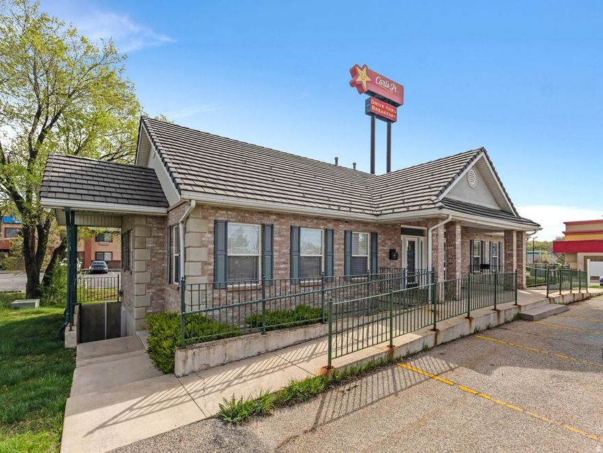 Are you looking for Prime Commercial Office Space that offers outstanding Visibility and High Traffic count? This Commercial Space is located next to I-15 and one of the Entrances to Hill Air Force Base.  There are 3 private offices upstairs and a bathroom, 2 private offices downstairs and a bathroom.  With a separate entrance to the basement, this set up is perfect for multi-tenant use. There is Signage and ample Parking. Call for more info and to set up your showing today.