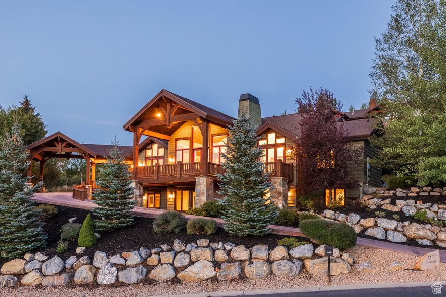 Located in the sought-after Hidden Meadows neighborhood of Lower Deer Valley, this beautifully updated mountain retreat offers breathtaking views, exceptional privacy, and convenient access to skiing, hiking, and the charm of Old Town Park City. Nestled on a quiet lot, the home blends timeless design with thoughtful upgrades, creating a sanctuary for both full-time living and seasonal enjoyment. The main level welcomes you with soaring vaulted ceilings, timber beams, expansive windows, and a dramatic floor-to-ceiling stone fireplace. The chef's kitchen is as functional as it is beautiful, featuring a Wolf 6-burner range, Sub-Zero refrigerator, copper farmhouse sink, large island with prep sink and seating for six, and pantry. A breakfast nook with a gas fireplace, formal dining area, and walkout access to over 900 square feet of decking provide effortless flow for entertaining and relaxation. The main-level primary suite features vaulted ceilings, a gas fireplace, balcony, and a spa-style bath with dual vanities, jetted tub, glass shower with dual heads, and custom walk-in closet with washer/dryer. Additional bedrooms offer en suite baths and flexible living options, including a lower-level family room with wet bar, wine cellar, gym, and patio with hot tub. Recent improvements include a new boiler, A/C, tankless water heater, new carpet, paint, lighting, fireplaces, upgraded security system, and a heated 1,000 square foot 3-car garage. This is an exceptional opportunity to own a beautifully cared-for home in one of Deer Valley's most desirable communities.