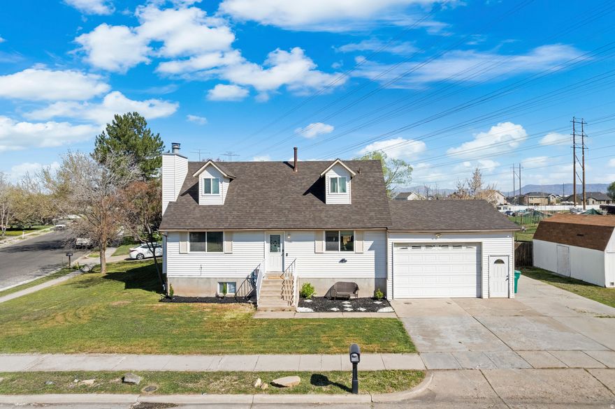 Positioned on a large corner lot with open views, this 5 bedroom, 3 bathroom home offers a functional layout with an open concept main level. The kitchen flows into the main living and dining areas, anchored by a large island and updated finishes.  A standout feature is the double level deck with access from both the kitchen and the primary suite, creating seamless indoor outdoor living.Backing to open land with horses next door and cows just across the street.  BRAND NEW ROOF and a fully fenced yard complete the home, all with convenient access to shopping, commuting routes, and local amenities.  No Showings until Open House April 4th 12-2pm