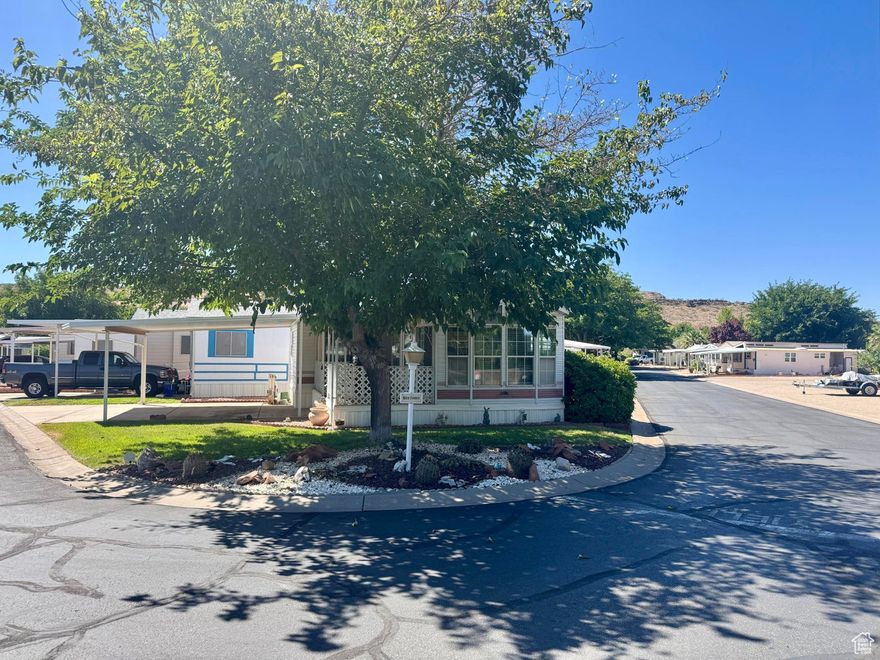 Immaculate 2 bed, 2 bath home on a desirable corner lot! Great sitting porch, covered front parking plus extra parking in the back. Lots of windows bring in natural light. Shade trees, grass, and a peaceful setting. Partly furnished and move-in ready! Buyer to verify all information.