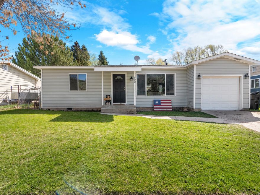 This charming 3-bedroom, 1-bath home is filled with natural light and features fresh updates throughout. New paint, updated trim, and stylish flooring create a bright, clean feel, while the functional layout offers comfortable everyday living. The kitchen has been refreshed and includes a welcoming bar area perfect for gathering along with a new refrigerator, dishwasher, stove, and microwave. A washer and dryer are also included for added convenience. Enjoy the added benefits of a 1-car attached garage and a spacious, fenced yard. Conveniently located near walking trails and local amenities, this home also presents a great opportunity for investors. Schedule your showing today!