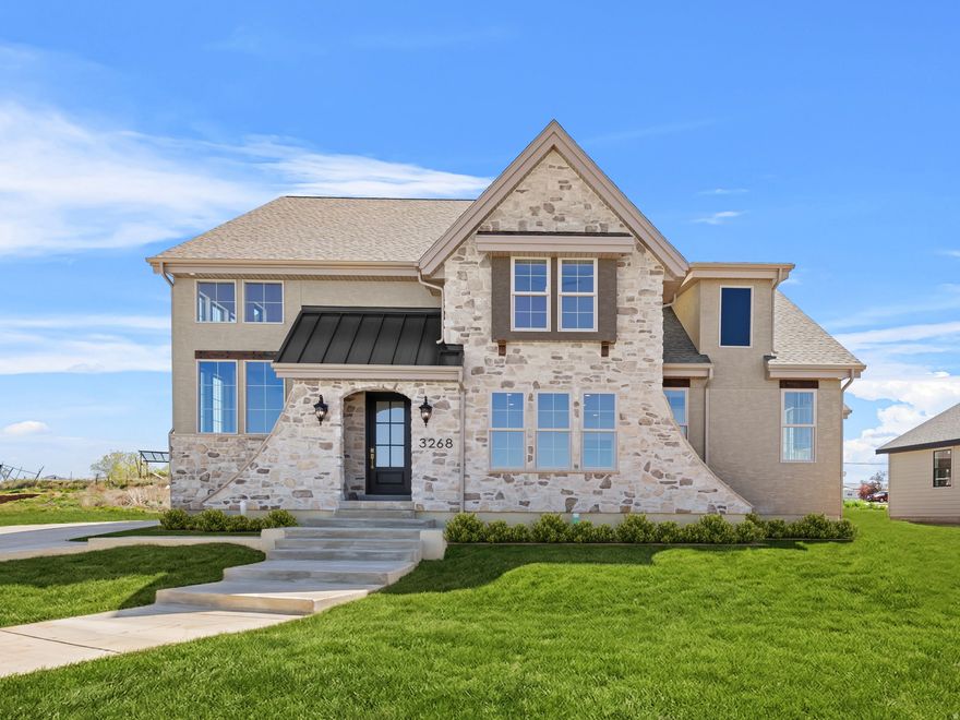 **Open House April 18 11-1** Unlike anything you've seen before! This stunning custom home offers the perfect blend of quiet country living with convenient access to nearby amenities. Built by Dalton Construction, this thoughtfully designed two-story home truly breaks the mold, featuring a fully separate, rentable ADU-ideal for extra income, guests, or multi-generational living. Step inside to a light-filled interior enhanced by an expansive window package that floods the home with natural daylight. The open-concept great room and kitchen showcase beautiful hardwood cabinetry in a rich walnut finish, extending to impressive 10-foot ceilings with under-cabinet lighting. Highlights include a custom 6-foot range hood, quartz countertops, and a show-stopping butler's pantry complete with a second sink, quartz surfaces, and direct access to the covered grilling porch. Durable, high-quality LVP flooring runs throughout the main level and ADU, offering both style and functionality. Relax by the elegant linear electric fireplace featuring a handcrafted mantel and hearth. The main-level primary suite is a true retreat, complete with an ensuite bathroom boasting a soaker tub, double vanity, custom-tiled shower, and a spacious walk-in closet. The ADU impresses with a vaulted great room, full kitchen with island, two bedrooms, a full bathroom, laundry area, and its own private garage. Upstairs, you'll find a second family room or rec space perfect for entertaining, along with three generously sized bedrooms and a full bathroom. Additional features include a covered back patio and an oversized four-car garage-perfect for vehicles, toys, and storage. This exceptional property delivers versatility, craftsmanship, and lifestyle all in one remarkable package.