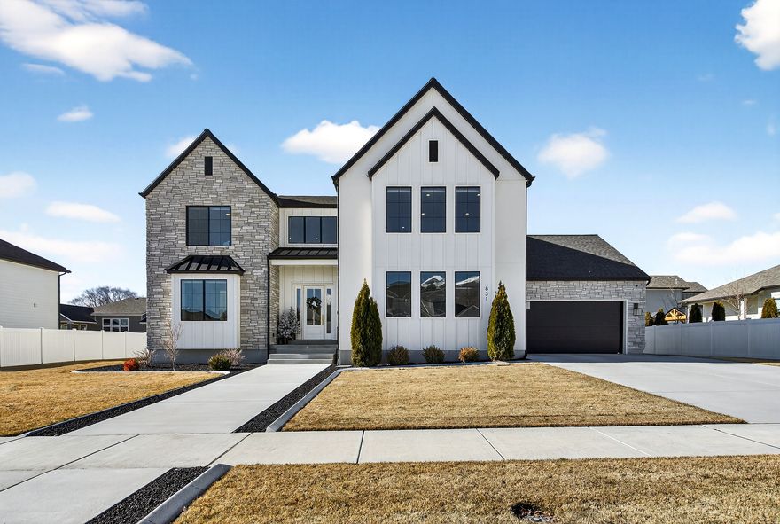 Please join us for an Open House Saturday 1/31/26 11:00-1:00! Why wait for a builder? Discover this "hidden gem" offering the ultimate mix of seclusion and convenience. Located on a quiet street, you are just 5 minutes from I-15, shopping, dining, and entertainment.  The heart of the home is a showpiece kitchen designed for functionality and style. Prepare meals with ease on expansive countertops that provide endless working space, surrounded by tons of cabinetry and a massive butler's walk-in pantry for superior storage. Large windows line the home, flooding every room with natural light and making the open floor plan feel even more spacious.  Enjoy true main-level living with a luxury primary suite, while the upstairs offers a spacious loft and built-in workstation. The fully finished basement is the ultimate recreation zone with room for a theater and game tables. Unlike new construction, this flat yard is fully finished and ready for play, complete with an EV charging station in the garage. Don't settle for construction delays-step into perfection today. Schedule your private tour now!  Special Financing Incentives available on this property from SIRVA Mortgage