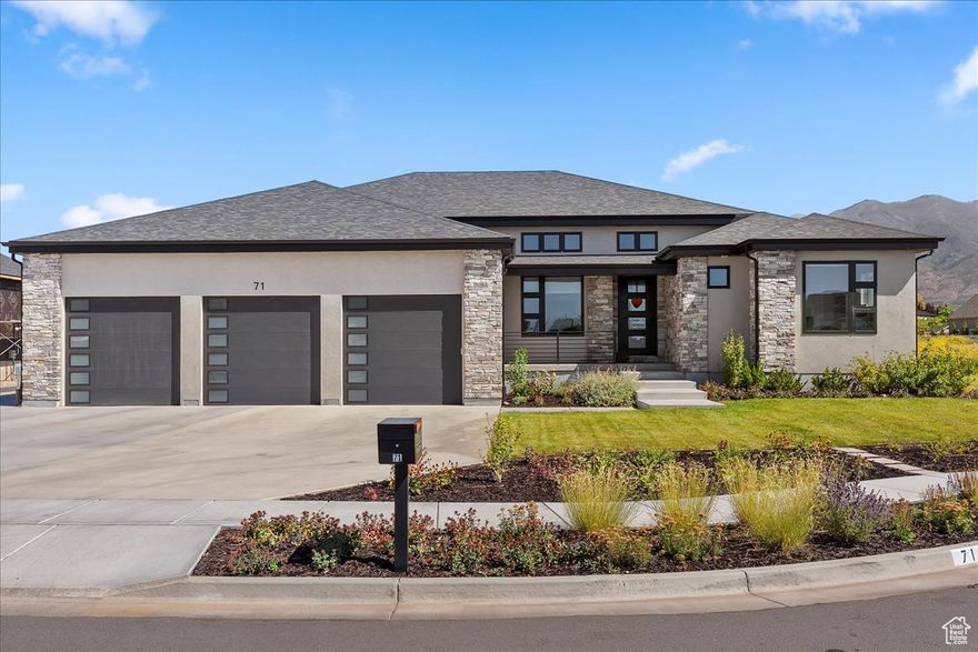 Amazing custom modern home in lovely West Kaysville neighborhood. Situated on a quiet and peaceful cul-de-sac with magnificent mountain views.  Three bedrooms and large bathrooms on the main floor include a beautiful master bedroom with a spacious spa-like bathroom with roll-in shower and stacked laundry in master closet. Second master bedroom with en suite bathroom and second roll-in shower would be perfect for family in multi-generational home or as a private quiet guest room. Third bedroom and bathroom would be perfect for young children or as an additional office space or guest room.  The open floor plan is built for entertaining guests or enjoying the spacious gathering area. Kitchen is equipped with high end appliances including double oven, Monogram gas range top with griddle and counter depth side by side fridge and freezer. The high ceilings, fireplace and many windows give a beautiful inviting atmosphere.   The basement 9 foot foundation and large windows give plenty of light and space for the four downstairs bedrooms. The entertainment room's large area has ample space for entertaining large groups.  There is a full kitchen, laundry and separate entrance that gives the option for an apartment in the basement. Another large bedroom would be perfect for a bunk room or theater or second family room. Dedicated exercise area and storage also in basement.  Plenty of parking for extra cars or boat on RV pad. The spacious three car garage also has extra space between cars and at the back for storage.  Landscaped with low water, low maintenance, native and resilient perennials and shrubs.  Plants provide year round color and interest, and provide food and habitat for pollinators. There are also two raised garden boxes and a garden area in the backyard. Covered patio for outdoor entertaining and large grassy area as well.   Access to both area freeways are just minutes away. Access to high speed fiber and/or Comcast networks available..  No HOA, just nice neighbors.
