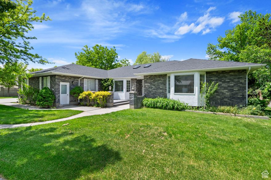 Gorgeous all Brick Rambler with a 6 car garage!! Detached 3 car Garage/Shop roughly 25'x35' with 220 power, heat and A/C.  Home has tons of upgrades like 250k in Cabinetry, Cherrywood floors, a self maintaining koi pond with waterfalls and fish, a massive covered deck that runs the length of the house, a fiber optic star ceiling in the basement, and half an acre of land.  The mother in law apartment has it's own private entrance with kitchen, and laundry. The master bedroom has it's own attached retreat with fireplace, perfect for a home office/business or nursery. Other features include  sub zero drawer fridge in the kitchen island and a warming drawer to keep food warm while cooking. Park like backyard with mature landscaping.