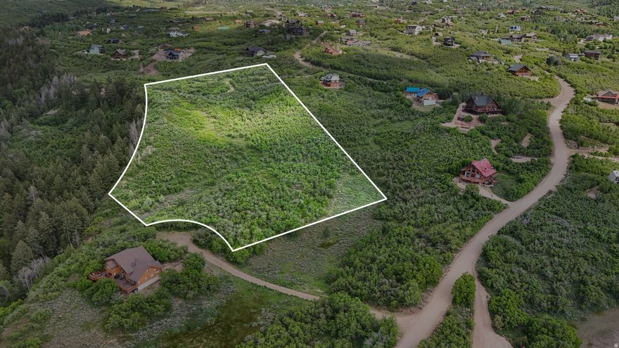 3.47 Acres with Septic Approval + Engineering Completed  Build with confidence on this exceptional 3.47-acre corner hillside lot - one of the largest parcels in the subdivision. This property comes with much of the groundwork already completed, including:   Passing perc test   Topographic survey   Approved septic design for up to an 8-bedroom home Engineered home plans are also available (negotiable separately), offering a head start for buyers ready to move forward. Tucked into a private corner setting, the lot offers year-round access and an ideal location for either a full-time residence or mountain retreat. Enjoy the peaceful surroundings while remaining just minutes from the amenities of Heber Valley and Park City. Outdoor recreation is truly at your doorstep - hiking, ATV trails, world-class skiing, snowmobiling, fishing, and golf are all nearby. A rare opportunity to secure one of the subdivision's premier lots with key approvals already in place. Acreage measurement given by county records.