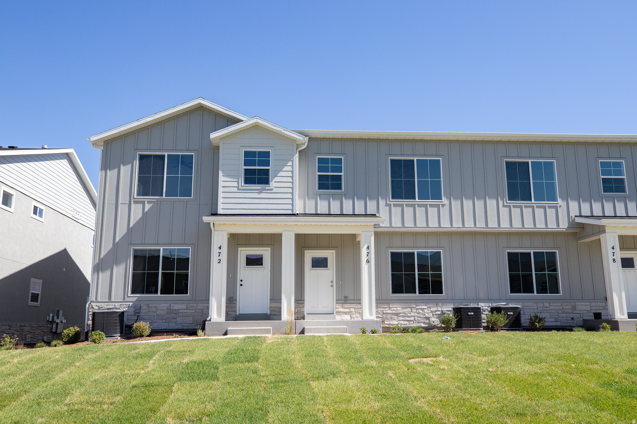 View of front of the townhome which borders a large park area