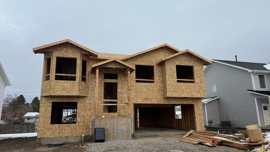 Offset your mortgage by charging your mother-in-law some rent in this beautiful under construction home in the heart of Logan.  Spacious 4 bedroom, 3 bath home.  Fully equipped mother-in-law apartment on the lower level with a private entrance, kitchen, family room, 1 bedroom, 1 bath plus separate  laundry hookups. Main floor offers ample living space and features 3 bedrooms, 2 full baths, family room and kitchen.  Reach out now to select interior paint color, flooring, carpet, cabinet color, countertops and some exterior vinyl colors.