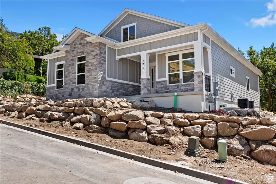 Amazing NEW custom home on the east bench of Farmington.  This home features  SINGLE LEVEL LIVING and a large basement ADU (Attached dwelling unit - 2 bedrooms / 1 bath).  This home is located close to various outdoor trails and parks (Bonneville Shoreline Trail, Davis Creek Trail, Flat Rock Trailhead, Woodland Park) along with local shopping at Farmington Station.    Owners bedroom / bathroom suite, kitchen, family room and laundry are all on the main floor with a 2nd story with 2 bedrooms, family room and bathroom.  This home has custom touches throughout from the custom cabinets, granite countertops, gas fireplace, walk-in pantry, 3-tone paint, custom lighting, custom finish work, large covered patio and so much more!  Home located at the end of a private road with only 4 homes!  Small maintenance fee of $40 / month for snow removal / maintenance of private road.
