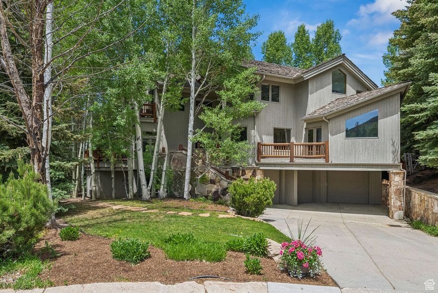 Quintessential Deer Valley Retreat in Solamere Neighborhood! Tucked away on a quiet cul-de-sac in the prestigious Solamere neighborhood of Lower Deer Valley, this timeless mountain home offers the perfect blend of privacy, comfort, and year-round recreation. Surrounded by mature trees on a beautifully landscaped third of an acre lot, the home borders protected open space, creating a serene alpine sanctuary just minutes from Park City's Historic Main Street. Boasting 6,061 square feet of thoughtfully designed living space, the home features six spacious bedrooms-including two cozy bunk rooms-ideal for family gatherings and entertaining guests. The luxurious primary suite is a peaceful retreat with its own private deck, sitting area, fireplace, and a spa-like bathroom complete with a sunken jetted tub. Designed for connection and comfort, the main level includes a light-filled living room with views of the ski runs, a well-equipped kitchen with breakfast nook, and multiple expansive decks that seamlessly blend indoor and outdoor living. Entertain effortlessly with an outdoor kitchen, fireplace, and hot tub, perfect for aprs-ski evenings under the stars. Additional amenities include an indoor racquetball court, sauna, two laundry rooms, and a three-car garage. Plus, there is a guest apartment with private entrance, second kitchen and living space.  The property includes membership to the private Solamere Pool & Tennis Club and access to the Deer Valley ski shuttle, offering on-demand door-to-door service to Snowpark Lodge. Whether you're hitting the slopes, hiking the nearby trails, or enjoying summer evenings on the deck, this Solamere gem is an exceptional year-round mountain home.