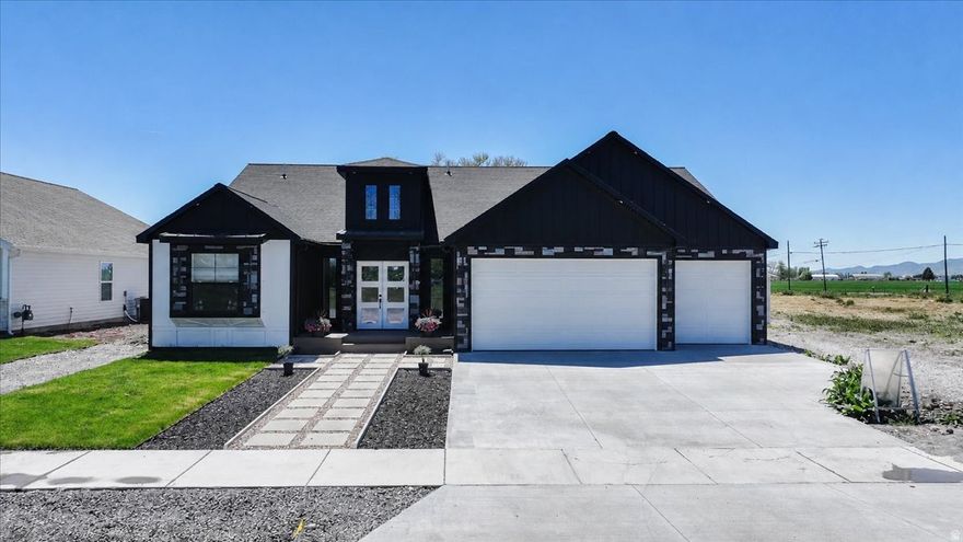 Welcome to this beautifully newly built home in the heart of Preston! Featuring 3 spacious bedrooms, 2.5 bathrooms, and a 3-car garage, this home offers the perfect blend of modern comfort and functional design. Step inside to find an open-concept layout with bright living spaces, quality finishes, and plenty of room for entertaining or everyday living. The kitchen flows seamlessly into the dining and living areas, creating a warm and inviting atmosphere. The primary suite offers a private retreat with an ensuite bathroom and generous closet space. Enjoy the convenience of a large garage with extra storage and room for vehicles, toys, or hobbies. Located in a growing neighborhood with easy access to schools, shopping, and outdoor recreation, this home is ready for you to move in and make it your own!