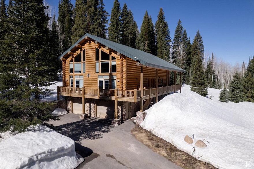 This extraordinary and private property is located 5 minutes and less than a mile from the Solitude Lodge, as well as just 9 minutes from Brighton Resort. It is ideal for large family gatherings or entertaining. The property is 3.98 acres and located at the end of a private road. The main house contains a large great room that contains a gourmet kitchen, equipped with a beautiful La Cornue range, Wolf Appliances, a built in Espresso Machine, and 2 under counter wine fridges. On the upper level there is a large sitting area, as well as the large master suite and an additional bedroom. On the main level is the oversized two car garage with plenty of room for your toys, and an additional sleeping area, bathroom and family room. The adjoining ''cabin''/ guest house is a quaint A-frame building that is able to sleep another 8-10 additional family or guests. Comes with a French drain system as well as an updated fire pit area with seating. Also included are the kids playground and hot tub!