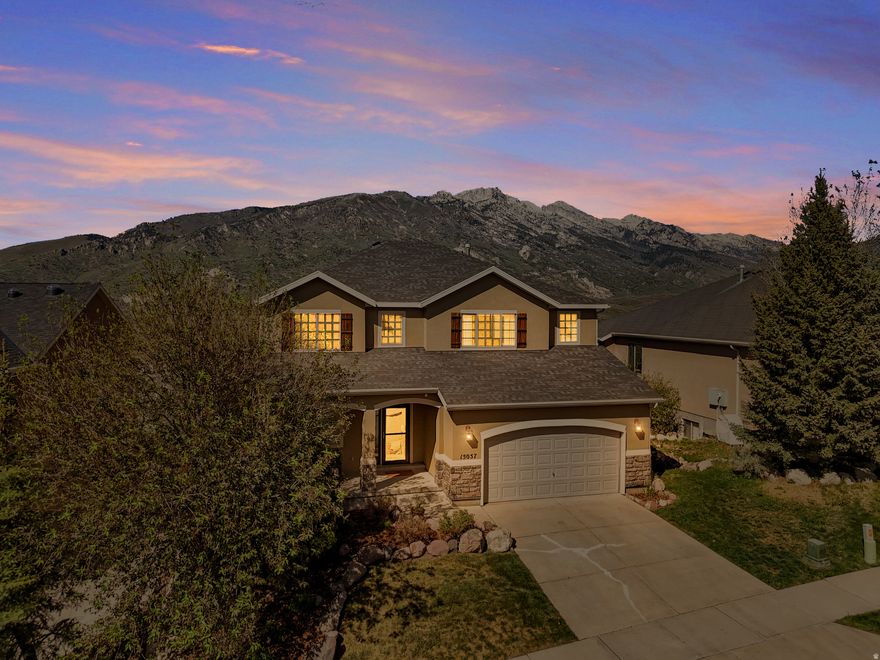 **OPEN HOUSE Saturday May 16th 11am-1pm** Here in SunCrest, some homes come with views that stop you mid-sentence. This is one of them.  Perched high above the valley floor on Winged Bluff Lane, this home sits with views that are genuinely hard to explain until you're standing in front of them. Timpanogos to the south, Lone Peak to the north, Box Elder rising dead center in the frame like it was placed there on purpose. Spring snowmelt, summer alpenglow, fall color bleeding down the ridgelines, winter peaks stacked white against a blue sky. There's no bad season from this backyard. Frankly, there's rarely a bad hour.  Inside, the bones are solid. The main floor lives with you, not against you, and the layout keeps pulling you toward the back of the home where those windows are. It's the kind of floorplan that was right when it was built and is still right today. Open enough to live in, defined enough to feel intentional.  Upstairs, the primary suite is spacious and private, with room to make it exactly what you want. The bathroom is already set up the way it should be: separate soaking tub, walk-in shower, dual vanities. The other three bedrooms are well-sized and well-separated, giving everyone their own corner of the world and, honestly, some of the best views in the house.  The lower level has been framed out and partially worked, with the heavy infrastructure in place. What it needs now is your vision. Drywall, flooring, finishes. A blank slate is hard to find these days.  Out on the 24x16 Trex deck, life stops. This is Utah beachfront. The yard is manicured and intentional, the views are wide open, and the quiet settles over the whole property in a way that's hard to find this close to everything. The trails are ready. The clubhouse, pool, and community events are firing on all cylinders. This season in SunCrest is its own thing: miles of trails, community events, neighbors who actually know each other. This deck puts you right in the middle of all of it without giving any of it up.  This home has room to be personalized, and whoever does it gets to do that work with Timpanogos, Lone Peak, and Box Elder as a permanent backdrop. That view isn't something you can add later. The canvas here is rare. So is the address.