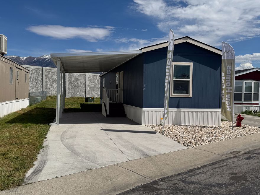 This 800-square-foot manufactured home in Mountain View Estates features two bedrooms and two bathrooms. Built in 2023, this modern home boasts an open-concept living and dining area, perfect for entertaining guests or relaxing with family. The sleek design includes updated fixtures and finishes throughout, creating a comfortable and stylish living space. With plenty of natural light streaming in through the windows, this home offers a cozy retreat for its residents. Mountain View Estates in Layton, UT, is a vibrant community offering a range of amenities for its residents to enjoy. From a clubhouse for social gatherings to a fitness center for staying active, there is something for everyone in this community. The well-maintained grounds feature walking paths and green spaces, providing a peaceful environment for residents to relax and unwind. Mountain View Estates is the perfect place to call home with easy access to nearby shopping, dining, and entertainment options.