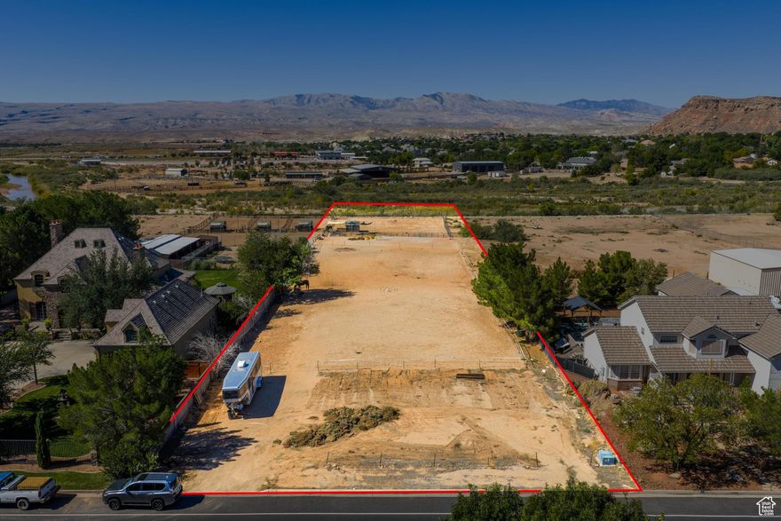 Rare Riverside Horse Property with Irrigation.   Discover an extraordinary opportunity on this expansive two-parcel vacant lot in a prime location, combining the serenity of riverfront living with equestrian and agricultural potential. Comprising parcels SG-BR-6-10 (front 0.49 acres) and SG-6-3-13-3412 (1.26 acres), this versatile property allows for a custom single-family home on the front parcel, with ample space on the back for outbuildings, barns, or agricultural structures. Nestled against a scenic river, it offers direct access to walking paths and equestrian trails  a true haven for horse enthusiasts.   Key features that set this gem apart:   Riverfront Bliss: Backs directly to the river for stunning views, wildlife, and endless recreation.  Horse-Friendly Zoning: Zoned for horses or livestock with easy access to equestrian trails  incredibly rare for river-adjacent property with these amenities.  Irrigation Ready: Pressurized water system with water shares from the Bloomington Water Company, perfect for lush pastures, gardens, or equine needs.  Utilities: All utilities available in front of the lot for seamless development. Powered by Dixie Power company which is known to provide some of the cheapest energy rates in the nation. To be verified by buyer  Site Prep: Excavation already done to improve leveling of lot Prime Proximity: Just minutes from Bloomington Park and its pickleball courts, plus convenient access to shopping and grocery amenities.  Endless Possibilities: Ideal for your dream home, hobby farm, or equestrian retreat  where luxury meets the great outdoors.    This is more than land; it's a legacy property that's hard to find in today's market. Don't miss your chance to own this slice of paradise. Measurements and boundaries to be verified by buyer