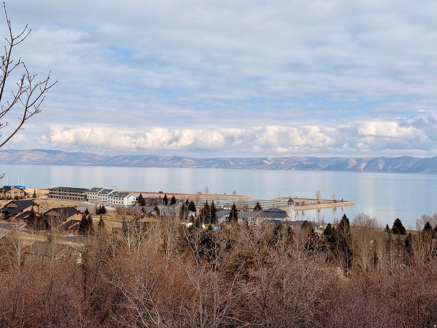 This beautiful building lot in Bear Lake is located across from the Bear Lake State Park Marina!  Paved roads, close to Garden City shops and restaurants!  Incredible view from this lot!  Short term rentals allowed!!  Use your creativity and build your dream vacation home!!  Year round accessible!!