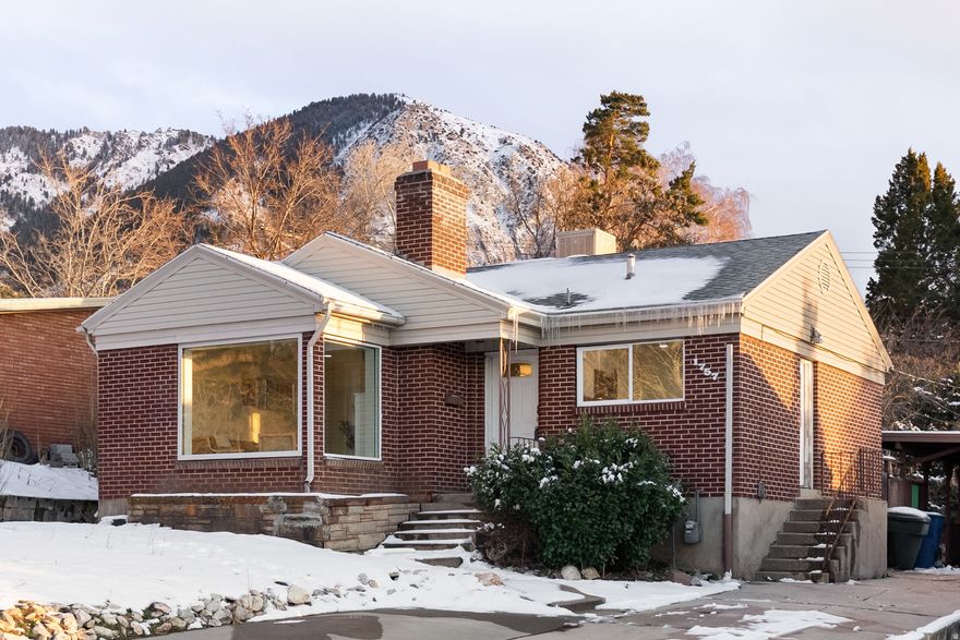 Discover the cutest home in Ogden's East Bench-a beautifully updated, all-brick gem that perfectly blends charm, flexibility, and breathtaking mountain views. Perched high on the coveted East Bench of Ogden, this fully renovated home offers stunning views of the surrounding peaks along with thoughtful, top-to-bottom updates throughout. Enjoy brand new paint, new flooring, new doors and trim, and new windows that fill the home with natural light while enhancing energy efficiency. The completely updated interior features two kitchens with new cabinetry and gorgeous new quartz countertops, along with two fully remodeled bathrooms designed with modern finishes and style. Major system upgrades provide peace of mind, including new electrical panels, electrical and plumbing updates throughout the home, plus a brand new furnace and new A/C for year-round comfort. One of the standout features is the private mother-in-law apartment, offering its own kitchen and living space-ideal for multi-generational living or long-term guests with separate entrance. Solid all-brick construction provides timeless curb appeal and durability, while the large, fully fenced backyard creates the perfect space for entertaining, pets, gardening, or simply relaxing while taking in the mountain backdrop. Located in one of Ogden's most desirable neighborhoods with convenient access to outdoor recreation, trails, downtown, and amenities, this East Bench beauty offers the rare combination of extensive modern updates and incredible outdoor space. Come see why this is truly one of the most charming homes in Ogden.