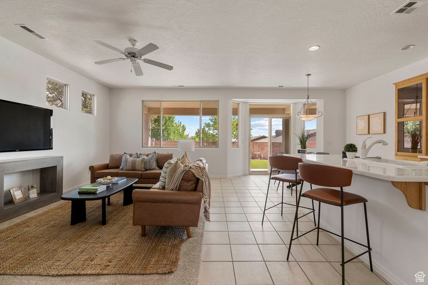 Welcome to this charming home in Coral Canyon featuring 3-bedrooms, 2-bathrooms, and a dedicated office that could easily serve as flex space for whatever fits your lifestyle. With new paint and carpet, this home is ready for its new owner! There is no shortage of storage in the home including cabinetry in the hallway, a large walk-in closet in the primary bedroom, and an oversized 2-car garage. Step outside to a private, peaceful backyard that's fully fenced, gated, and beautifully landscaped with low-maintenance turf and native plants. The extended covered patio offers the ideal setting for relaxation and entertainment year-round. As part of the Coral Canyon community, you'll have access to fantastic amenities, including an 18-hole golf course, pickleball and tennis courts, parks, playgrounds, walking paths, a clubhouse with both indoor and outdoor pools, a pavilion area, and a fully-equipped workout facility. With easy access to shopping, dining, outdoor recreation, and within walking distance of Coral Canyon Elementary School, this home makes a wonderful primary residence, vacation getaway, or investment property.  Don't miss the chance to live in one of Southern Utah's most desirable communities and schedule a private showing today!