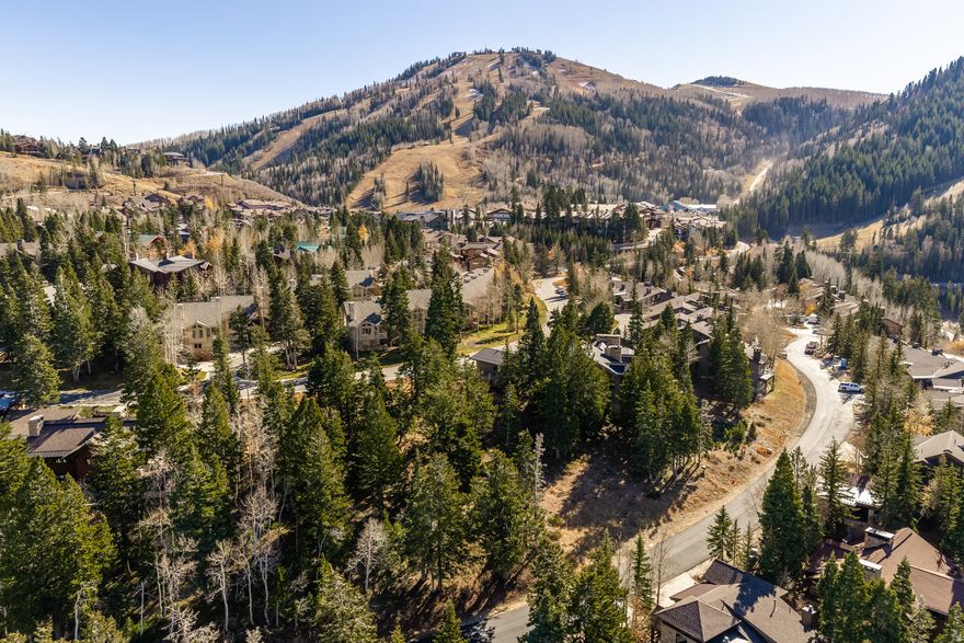 Large .73 acre gently sloping parcel is studded with mature evergreens and offers expansive views to Deer Valley ski slopes and the mountains of the Park City Crest. Easy ski access via neighborhood trail or in Silver Lake Village. Restaurants and shops are a short walk on quiet streets and sidewalks. Start your ski day mid-mountain to enjoy early access to Deer Valley's best skiing. Park City's Historic Main Street's attractions are just five minutes away and easily accessible by free bus service.  One of only three vacant homesites in Deer Valley's mid-mountain Silver Lake neighborhood. Property is on a private road and is not subject to HOA regulations.