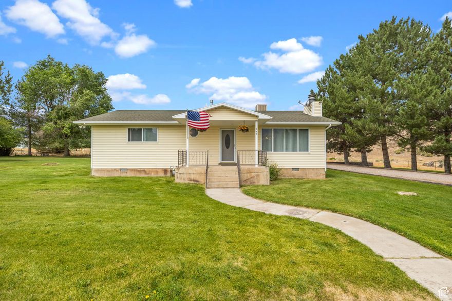 This single-level home sits on a 1.19-acre lot and offers a spacious, open layout with generous living and kitchen areas-ideal for everyday living and entertaining. The property includes a detached garage/shop and a separate workshop area, providing excellent space for storage, hobbies, or equipment. Plenty of room to spread out, both inside and out, with a functional layout and a quiet setting just minutes from your favorite outdoor recreation spots.   Seller financing available with 15% down, 5-year balloon, and 5 to 6% interest-contact agent for terms.