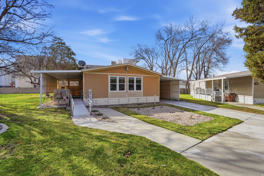 Located ideally in this outstanding 55+ community, you will love what you find at 1551 Indian Summer Dr. Amazing main-level living with tons of open space, a nice open living room and kitchen, 2 bedrooms, and 2 full baths, including a very convenient walk-in tub. Updated flooring, tankless water heater, and all appliances included. The den is perfect as an office or guest room, or can be converted into an official third bedroom. Spacious primary bedroom, complete with a closet organization system, and en-suite with a separate tub and shower. Conveniently located near trax station, public transportation, shopping centers, restaurants, and much more. This lot is unique to the community, one of the few lots with two sheds, one of which is currently used as a workshop. This is ideal for a hobbyist or anyone wanting their own unique shed space, with plenty of beautiful bulbs planted, a lovely raised garden area, and more. Outdoor living on this lot is fantastic. Ramp is included, and it is set up very nicely for wheelchair accessibility. Schedule your showing today!