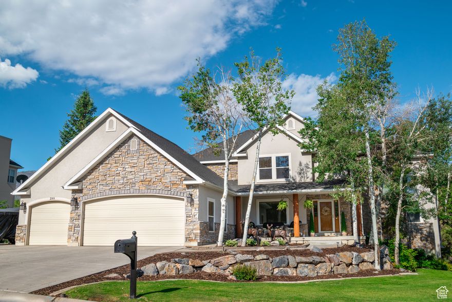 Price Improvement! This Immaculate home has that cabin Park City vibe with classic upgrades that will make you feel like you're on vacation every day! Relax in the scenic and private backyard, on expansive deck or listen to the peaceful waterfall feature while roasting mallows in the hidden hillside fire pit. The custom playground and playhouse (with electricity) will keep the kiddos happy too. Inside you'll be wowed by the impressive open layout with vaults and a grand floor-to-ceiling rock fireplace, majestic log mantle, railing and staircase. The massive windows allow natural light and beautiful views. There are many custom finishes throughout the home with 6 spacious bedrooms and most boasting walk-in closets. The downstairs has a full (not your average!) lovely Mother-In-Law apartment, wood burning stove and cottage-like kitchen that warms the soul and you can also step out onto the shaded covered patio. Honorable mentions include the huge storage room, RV parking, three car garage with workbench, newer roof and carpets, water softener, alarm system, storage shed, enclosed garden area and plenty of fresh mountain air. This is a must see in person. You've found your dream home in Elkridge, Utah.