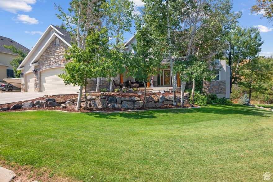 BACK ON THE MARKET!  June 2.  This stunning home has that vaca Park City vibe so you cannot help but relax with its very lush and private backyard, beautiful deck, and plenty of extras like the peaceful waterfall feature, hidden fire pit on the hillside, 6 spacious bedrooms and two offices. The playground and custom playhouse (with electricity) is guaranteed fun for the kiddos and Inside you'll be wowed by the impressive rock fireplace and majestic log mantle, railing and  staircase. You will also love the massive windows that allow all that natural light in to surround you throughout the home. Downstairs has a full (not your average!) cozy mother-in-law apartment--or not! A wood burning stove and cottage-like kitchen warms the soul and has a huge storage room and walk out onto the covered patio. Honorable mentions are RV parking, three car garage with workbench, newer roof and carpets, water softener, alarm system, storage shed, enclosed garden area and  plenty of fresh air. You've found your dream home in Elkridge Utah!