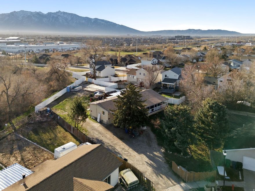VIEWS, VIEWS, VIEWS!  Rare opportunity to own your own lot and build your modular home on this HUGE corner lot.  Over 1/3 acre nestled in a culdesac and overlooks the beautiful Wasatch Front mountain range and valley below.  NO neighbors behind property. Never before on the market.  Imagine building your home with a deck off the back overlooking the stunning views and offering privacy.  This is an estate sale.  There is an existing structure on the property with a walkout foundation. Utilites are connected.  However, this is being sold for the land and seller makes no warranties on the structure.  Buyer will be responsible for the renovation or removal of the existing structure.  Sold as is. Taxes based on existing structure. Agent is related to seller/trustee