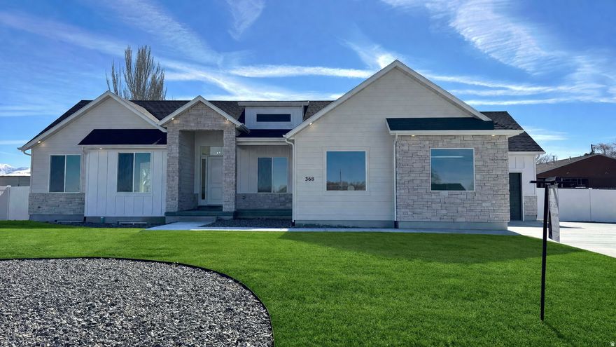 Discover refined living in The McKenna, a beautifully crafted new home located in a quiet neighborhood in the heart of Grantsville. This thoughtfully designed residence combines modern features with timeless style, offering comfort, convenience, and elegance in every detail. Step inside to stunning LVP flooring that flows seamlessly throughout the main living spaces, providing both durability and a high end look. The kitchen features a built in oven and cooktop, sleek cabinetry, and an included refrigerator perfect for everyday living and entertaining alike. Relax and unwind in the spa-like bathroom, complete with a tiled shower and stylish Euro glass surround, adding a touch of luxury to your daily routine. Whether you're enjoying peaceful mornings on the porch or hosting gatherings in the open-concept living area, The McKenna is the perfect place to call home.