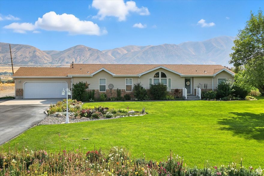 Immaculate country home on acreage you won't want to miss! This meticulously maintained property features 3 bedrooms, 2 bathrooms, a spacious family room, and a formal living room with a fireplace. The beautifully updated kitchen offers modern finishes while maintaining a warm, inviting feel. Enjoy the outdoors with a large covered patio overlooking the landscaped yard. The property also includes a 30x40 detached shop, perfect for storage or projects, along with an attached 2-car garage for added convenience. Bring your animals-there's plenty of space to accommodate them. Unregistered shallow surface well used for lawn.   Square footage figures are provided as a courtesy estimate only and were obtained from building plans.  Buyer is advised to obtain an independent measurement. 1.24 acres to be broken off of larger parcel.