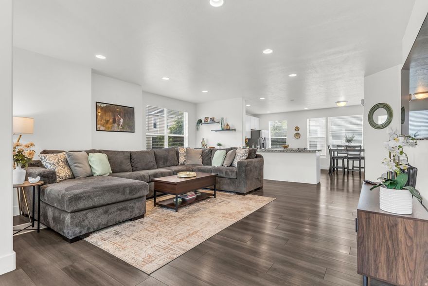Modern move in ready townhome ideally located in the heart of Murray, very close to parks, gyms, grocery, coffee shops and restaurants. Step inside to find a large foyer with sliding glass doors that lead to a peaceful patio. Large open living room is adorned with views of the mountains and an inviting balcony, the open kitchen, dining space is flooded with light, well appointed island and huge pantry. Stunning views of Mt. Olympus as you wake up every morning in this oversized bright primary bedroom retreat w/ walk-in closet, large double vanity and shower.  Updates include new refrigerator, serviced a/c unit, smart thermostat and smart garage door MyQ app.  Square footage figures are provided as a courtesy estimate only and were obtained from county records.  Buyer is advised to obtain an independent measurement and confirm all details.