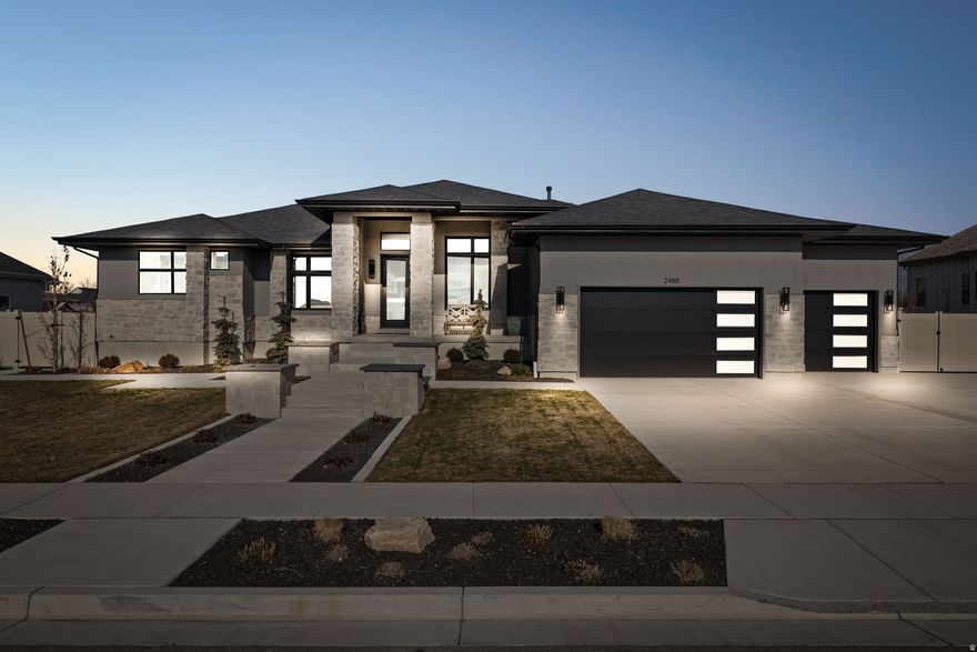 This 2023 custom home in College Farms was designed with both beauty and everyday living in mind. With approximately 4,816 sq ft, it offers 5 bedrooms, 4 bathrooms, and a fully finished basement, creating space that feels comfortable, intentional, and easy to enjoy.  The main level features an open layout anchored by a chef's kitchen with quartz countertops, double ovens, gas range, walk-in pantry, and custom cabinetry that is ideal for gathering, hosting, or simply settling in. Vaulted ceilings and large windows bring in natural light and give the home a warm, elevated feel throughout.  The primary suite offers a quiet retreat with a spa-inspired bath and generous walk-in closet. Downstairs, the finished basement provides flexible space for guests, movie nights, or everyday living.  If you enjoy spending time outdoors, this backyard is where you'll want to be. Set on a .48-acre fully landscaped lot with patio space, open lawn, and sweeping mountain and valley views, it's perfect for entertaining or unwinding at the end of the day. Community pool access, a 4-car garage, RV parking and low HOA complete this thoughtfully crafted home in one of Lehi's most desirable neighborhoods.