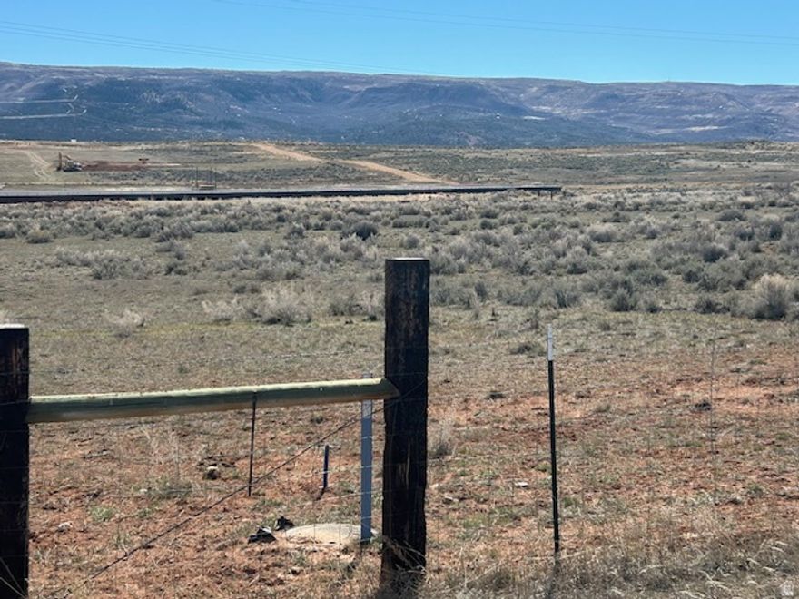 5 acre home site, set up for animals. The culinary water connection is paid, which is over 20k now. And power is available. Property is fenced on 3 sides, and the seller will have the west fence completed before closing. Ideal home site 1  hours from the Wasatch front, with plenty of room for your horses and other animals. This is a rare lot that is ready to build. Water is paid, power is available, and it fronts a maintained gravel road.