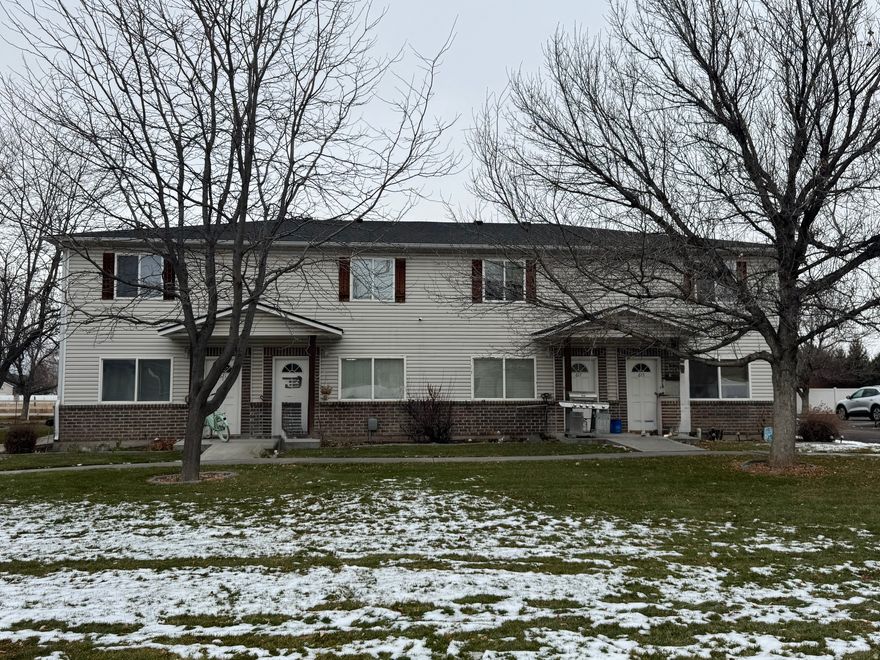 Located in the heart of Rexburg, Idaho - Home of BYU-I - This inviting townhome offers the perfect bled of comfort, convenience, and strong rental potential.  Just minutes from campus it's ideally positioned for students, faculty, or young professionals in this  vibrant college town.  Step inside to a bright, nice open-concept living area,  Great for everyday living.  Main level includes a convenient half-bath, kitchen features a built in desk and  extra  counter space with a large bar,  while upstairs you'll find two comfortable bedrooms, a full bath that is split so the tub/shower and toilet are separate from the double sink counter. Laundry located conveniently between the bedrooms  (washer & dryer included).  This property is well-maintained and move-in ready.  Friendly community featuring a playground and large grass common area.   This subdivision includes a large common building with a full kitchen, upstairs game room and  separate movie room  for hosting friends and family.   Don't miss this opportunity  in one of Idaho's most desirable college communities.  Contact us today to schedule a showing.