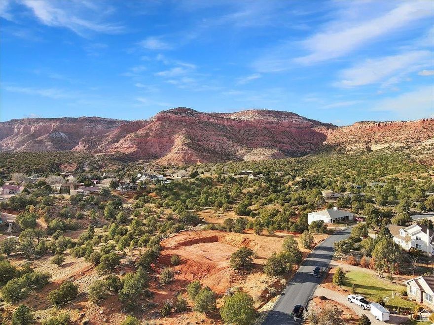 Beautiful, scenic 1.39 acre parcel.  A great view of the red rock hills from the back yard with lots of space to build your dream home.  This lot is not part of an HOA and would be great for full time residence.  You would also have the option to short term rent if you want to use the home for recreational or part-time use.   This is a great location with relativley close access to Bryce Canyon, Zion Nation Park, Lake Powell, the Grand Canyon, and other great scenic destinations.  The lot next door is also available.  Buyer to verify all.