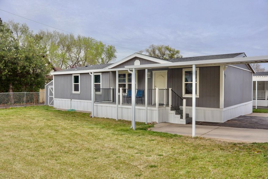 Great opportunity to own in a convenient Sandy location! This mobile home is located with easy access to State Street and just minutes from I-15, making commuting simple. Close to shopping, dining, and entertainment, this home offers affordable living in a desirable area. Featuring 3 bedrooms, 2 bathrooms, and a bright, functional living area, it also includes a covered front porch and partially fenced area perfect for relaxing outdoors, pets, or entertaining. Parking for up to 3 vehicles. Property sold AS-IS. Square footage figures are provided as a courtesy estimate only and buyer is advised to obtain an independent measurement.