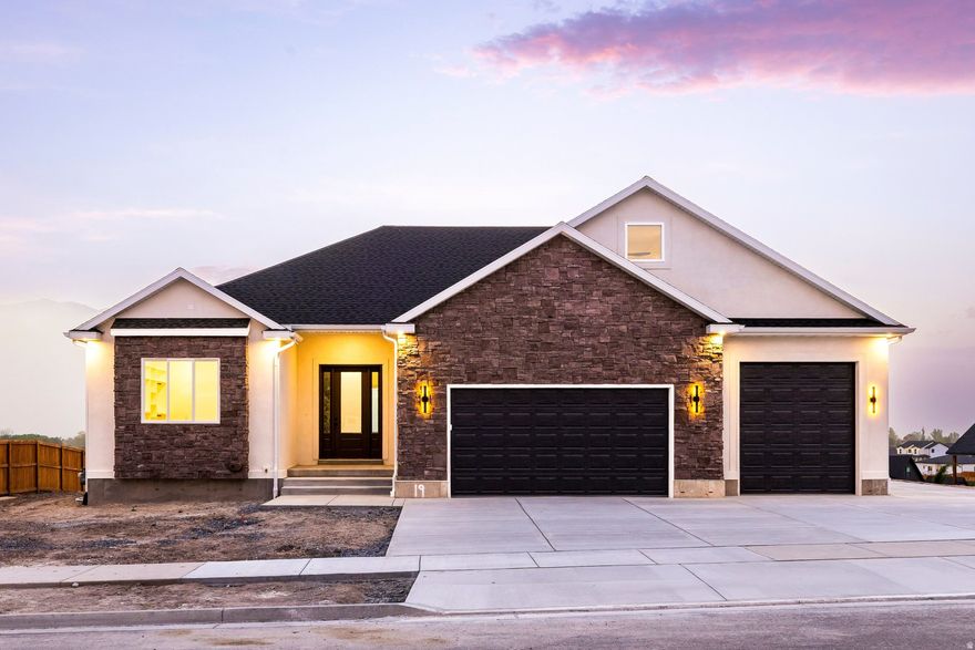 Brand new construction with unobstructed views and finishes chosen with intention. Set on .37 acres in a quiet Hyrum neighborhood, this home was designed to frame the landscape. Oversized windows bring the outside in, while the primary suite opens to a deck made for slow mornings and quiet evenings. The main level is anchored by a beautiful kitchen and inviting family room with a fireplace, alongside a beautifully appointed primary suite. Upstairs, a loft offers flexible space for work or play. The fully finished basement has 3 additional bedrooms, a full bath, and a generous area for gathering and entertaining, complete with a walkout patio that extends living outdoors. A 4 car garage and dedicated RV pad provide space to move, store, and more. Located at the base of the Bear River Mountains in Cache County, just minutes from Hyrum Reservoir and the amenities of Logan within a few miles, this is a home that balances space, design, and setting. Private showings available, call us to schedule!