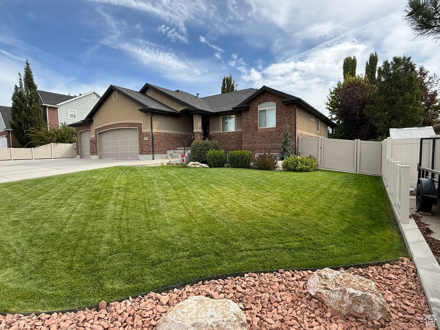 Discover spacious family living in this beautifully maintained 4-bedroom, 3-bath home with a 90% finished basement and lots of storage downstairs as well as upstairs, 3,774 sq ft of living space. Thoughtful layout features fireplaces upstairs and downstairs, an extra-wide staircase, 40-inch hallways, a large laundry room, and a primary suite with separate walk-in closets. There are durable Corian countertops throughout, Entertain easily on the covered patio with spa and in the low-maintenance, fully fenced yard ideal for gatherings. Practical extras include a 4-car attached extra-deep garage with workbench, a detached single-car garage (13 x 24), and a 19 x 50 concrete RV pad with RV electrical hook up. Move-in ready, family-focused, and built for convenience and storage. 3' x 5' Champion Gun Safe included.