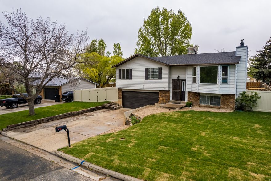 Charming Home in Cottonwood Heights Subdivision  3-bedroom, 2-bathroom home. Built in 1982, this spacious 1,626 sq. ft. residence offers the perfect blend of comfort and potential. Brand new, fully landscaped yard, and new deck, ideal for outdoor entertaining!   While this home is priced to sell and ready for your personal touch, it does require some TLC to unlock its full potential. Don't miss this fantastic opportunity to make this charming house your dream home! Schedule a showing today! Square footage figures are provided as a courtesy estimate only and were obtained from County Records.  Buyer is advised to obtain an independent measurement.
