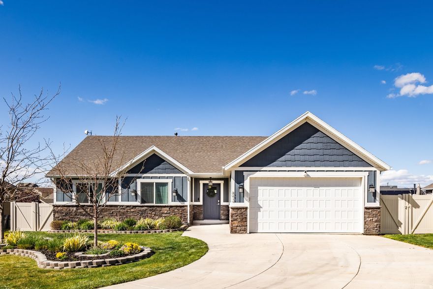 Located in a quiet cul-de-sac, this open floor plan rambler built by Les Allen Construction, offers full main level living. Enjoy entertaining with an over-sized kitchen island, walk-in butler's pantry, large back deck for dining and BBQ. Retreat to the primary suite just a few steps away from the family room, and relax in the ensuite bathroom with a large full tile shower, makeup vanity space, and walk-in closet.   The walk-out basement features two exterior entrances which allows for the unfinished half to be converted into a 2-bedroom mother-in-law basement apartment for rental or multi-generational living, or to be finished for your own space. Currently, the basement is ready to enjoy as game rooms, entertaining space, or as a theater room under the suspended garage. A wet bar, bathroom, and one bedroom are also finished. The backyard is partially landscaped and ready for your finishing touches of sprinklers and sod.   A short walk away is Sunset park which offers a playground, picnic area, and splash pad. Also nearby are soccer fields and pickleball courts. Multiple charter schools are also nearby including: CS Lewis Academy, American Preparatory Academy, and American Leadership Academy. All information herein is deemed reliable but is not guaranteed. Buyer is responsible to verify all listing information, including square feet/acreage, to buyer's own satisfaction.