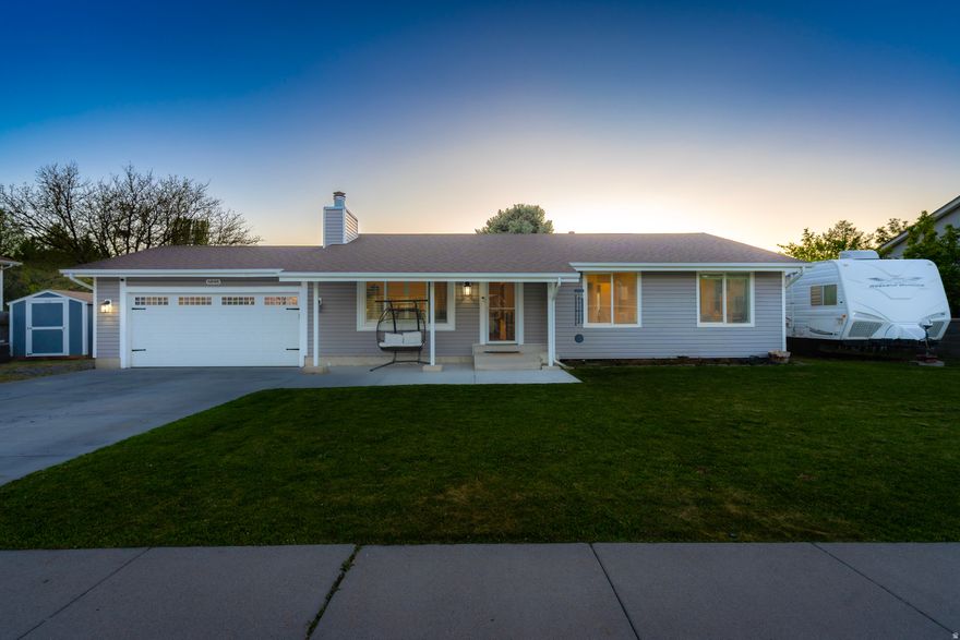 Updated West Jordan rambler offering 4 bedrooms, 3 bathrooms, and 2,436 square feet of well-designed living space. Interior features include vaulted ceilings, recessed lighting, quartz countertops, oversized cabinetry, and updated finishes throughout. The primary suite includes a custom tile shower, heated bathroom floors, and a spacious walk-in closet. The fully finished basement provides a second family room, two additional bedrooms, a full bathroom, and added storage. Outdoor features include a covered patio, fully fenced yard, and enclosed pen suitable for a dog run or hobby animals. The garage is equipped with 220V power for tools, equipment, or RV hookups. Conveniently located near freeway access, parks, schools, shopping, and dining. Buyer and buyer's agent to verify all information, including square footage, acreage, and property details.