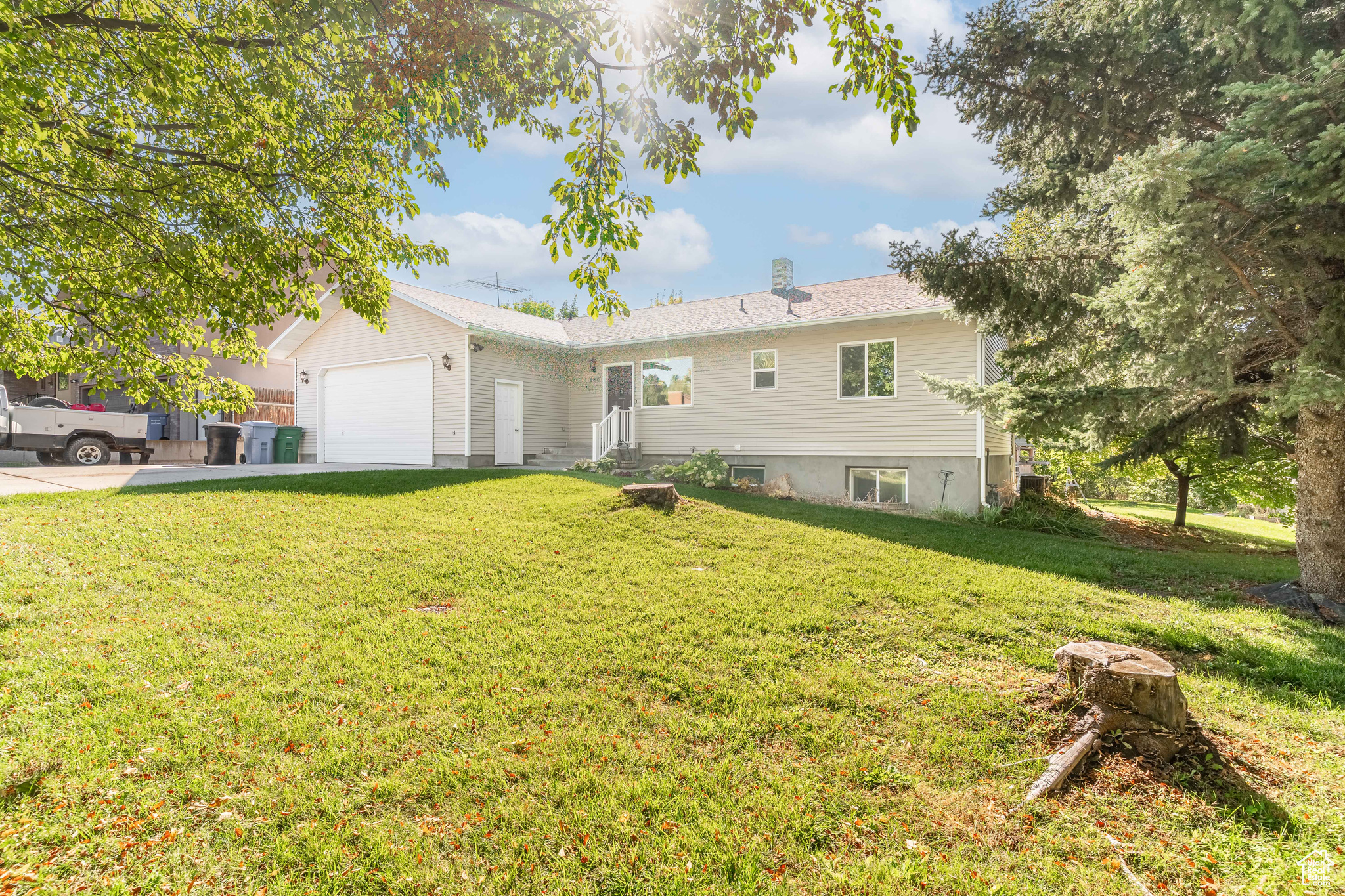 Beautifully maintained rambler on the east bench of Hyde Park. This 5-bedroom, 3-bath home offers 2,822 sq. ft. on a .38-acre lot with a daylight walkout basement. Updates include windows (2018), roof (2019), A/C (2020), water heater (2021), refrigerator, dishwasher, and carpet (2025). Features mature landscaping with fruit trees and a garden area, partial fencing, RV parking, and convenient access to schools, parks, and amenities. Square footage figures are provided as a courtesy estimate only and were obtained from a previous appraisal. Buyer is advised to obtain an independent measurement.